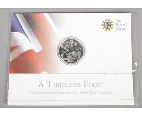 A Royal Mint Timeless First, The George and the Dragon 2013 UK Â£20 fine silver coin. In original packaging.  