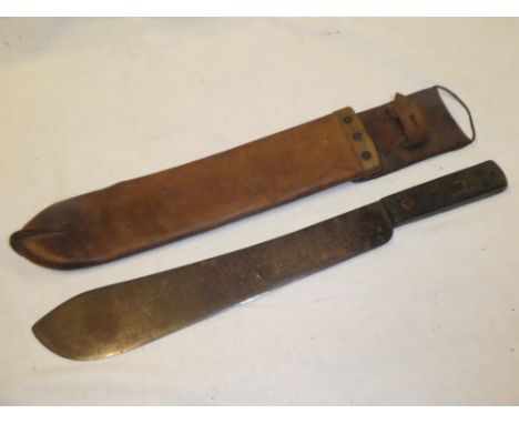 A military issue jungle machete in leather sheath