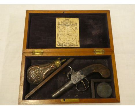 A 19th century percussion pocket pistol with 1¾" steel barrel, engraved frame and walnut stock contained in a mahogany baize 