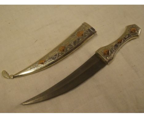 A Persian dagger with  7" double-edged curved blade in silvered hilt with matching scabbard engraved "Sir Geoffrey Todd in ap