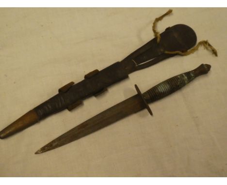 An original FS-style Commando dagger with 6¾" blade and ribbed grip bearing the crosskeys emblem for Nowill &amp; Sons in bra