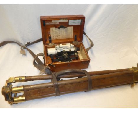 A painted metal surveyor's level by E R Watts &amp; Son London in fitted wooden case together with a folding brass mounted wo