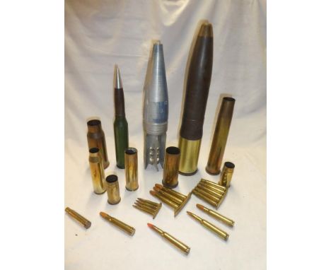 A selection of various inert ordnance and shell cases including armoured practice shell, aluminium shell head, various other 