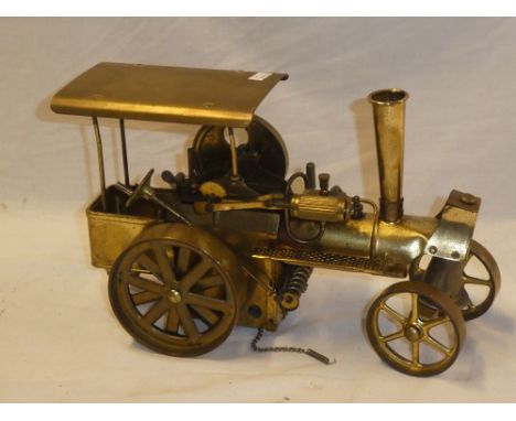 A brass scale-built steam traction engine model