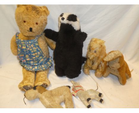 A selection of old soft toys including dogs, teddy bear etc.