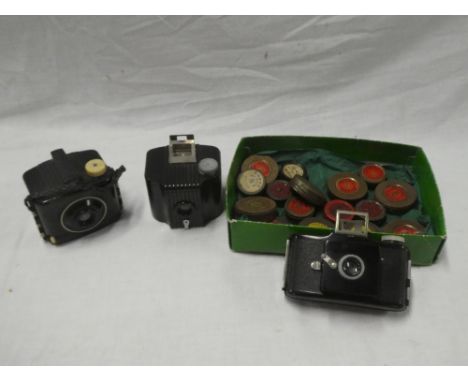 Two Kodak 3 Baby bakelite cameras together with various filters etc.