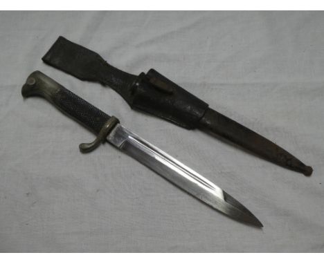 A Second War German parade bayonet with single-edged blade by Eickhorn in steel scabbard with leather frog