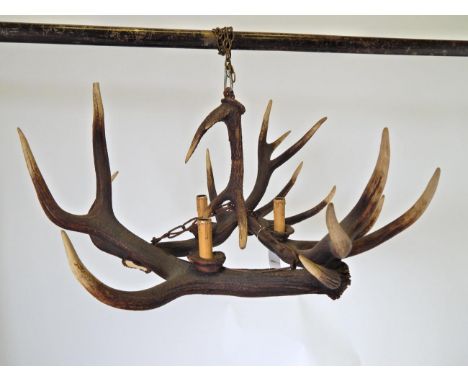 An Austro-German Red Deer Antler Mounted Chandelier, constructed from three adult Red Deer antlers, fitted with three candle 