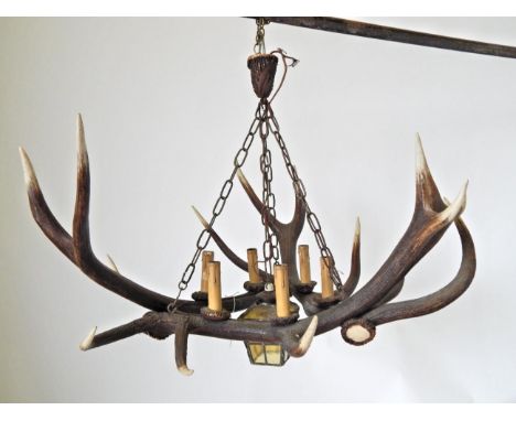 An Austro-German Red Deer Antler Chandelier, constructed from three Red Deer antlers fitted with seven candle style bulb hold