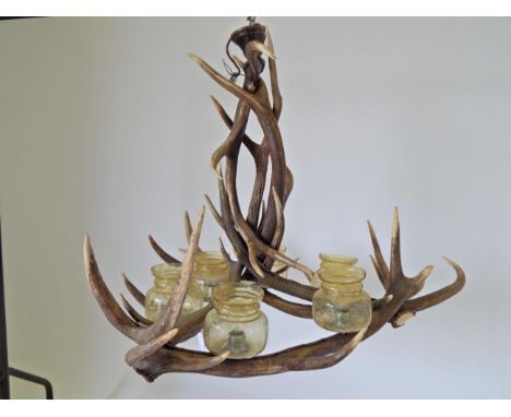A Large Austro-German Red Deer Antler Chandelier, constructed from eight adult Red Deer antlers fitted with six light fitting