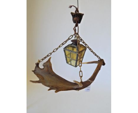Two Fallow Deer Antler Mounted Hanging Ceiling Lights, one light mounted with a leaded amber glass lantern and chain for hang