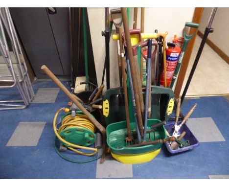 A Collection of Various Garden Tools, Walking Sticks, Hose Pipe, Lawn Spike and Fertilizer 