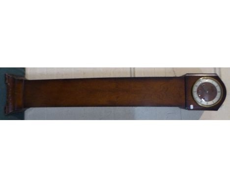 An Edwardian Walnut Cased Grandmother Clock with Westminster Chime Movement