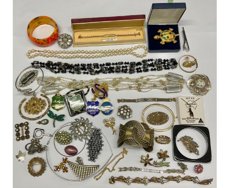 Costume Jewellery - an Australian gold plated kangaroo brooch, set with a sliced opal; a gold plated christening bangle; a no