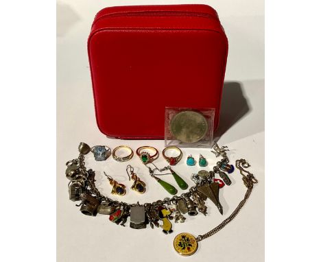 A selection of Jewellery in a red leatherette jewellery box; the jewellery includes; a "STERLING" stamped charm bracelet full