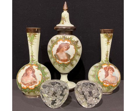 A continental opaque glass garniture, comprising central ovoid vase and cover, flanked by a pair of bottle vases, each printe