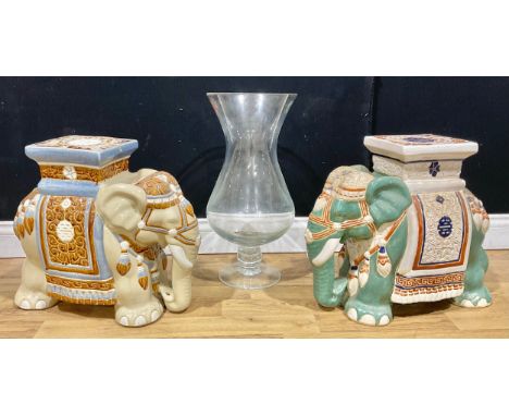 A Chinese pottery garden stool or jardiniere stand, as an elephant, glazed in tones of green and cream, 43.5cm high; another 