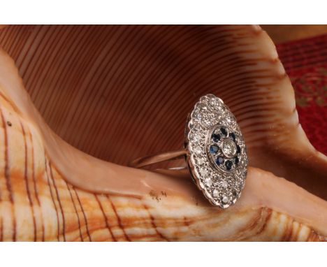 Vintage 18ct white gold Diamond and Sapphire ring The ring has a centre round brilliant cut diamond that measures approx. 0.0