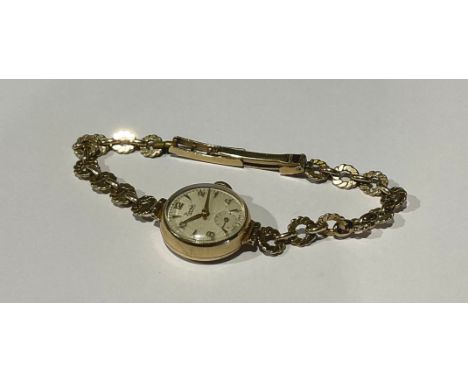 A Ladies Vintage 9ct Gold Everite swiss made mechanical watch with 9ct Gold watch bracelet; stamped "375" on the bracelet, wi