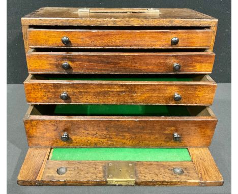 An early 20th century oak engineer’s tool cabinet