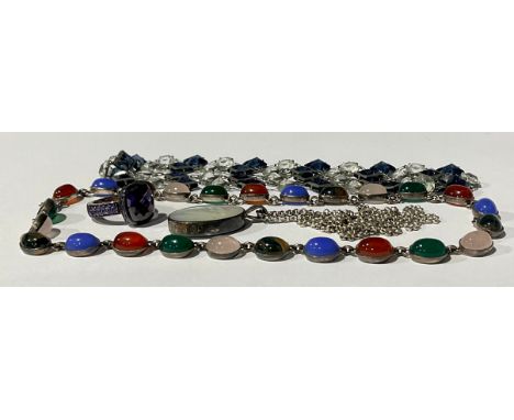 A selection of Silver and Unmarked White Metal Jewellery To include; a Thomas Sabo purple paste stone ring, a Mother of Pearl