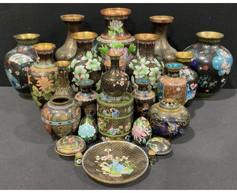 An early 20th century Chinese cloisonné enamel vase, honeysuckle pattern on a black ground within Ruyi borders, 18.5cm high; 