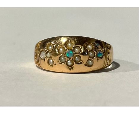 A 15ct Gold Opal and Seed Pearl Ringset with twelve melee seed pearls and three melee round cabochon opals, stamped "15 625",