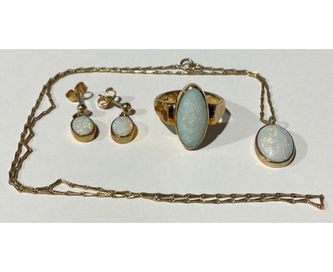 A selection of 9ct Gold Opal Jewellery To include; a "375" stamped opal ring (ring size N), a "375" stamped pair of opal drop
