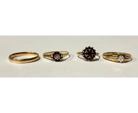 Four 9ct Gold Rings;to include; a wedding band, a garnet cluster ring, a garnet and illusion set diamond ring and a single cu