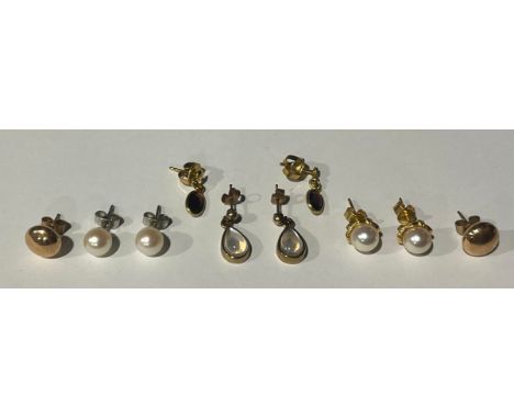A selection of Gold Earringsto include; four pairs of 9ct Gold earrings; cultured pearl, moonstone, garnet and plain button s