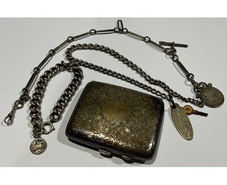 A George V silver rounded rectangular cigarette case, engraved with foliate scrolls, vacant central anthemion cartouche, 8.5c