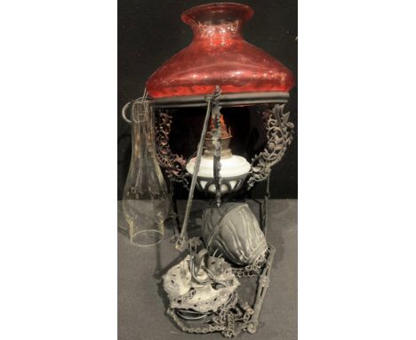 An adjustable weight hanging lamp, cranberry glass shade, approx 44.5cm excluding hangings