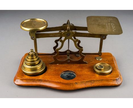 An early 20th Century brass mounted Postal Rate scales for Letters with various weights, approx 23cm wide