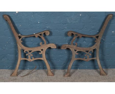 A pair of cast iron bench ends.  