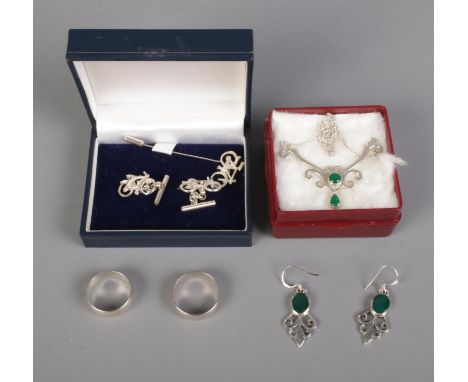 A collection of silver jewellery including necklace and earrings, two rings and bicycle themed cufflinks with tie pin.  