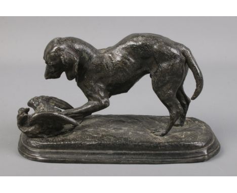 A cast spelter figure of a hunting dog with duck.16cm long  