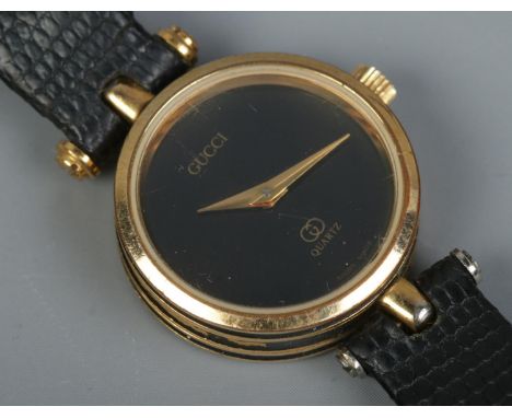 A ladies Gucci quartz cocktail watch, on black strap.  