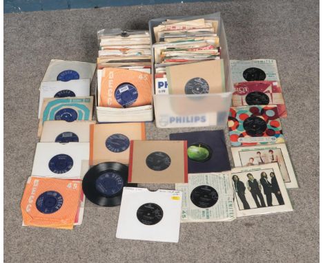 Two boxes of The Beatles and The Rolling Stones single records.  