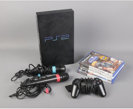 A Playstation 2 games console with controller, accessories and small selection of games.  