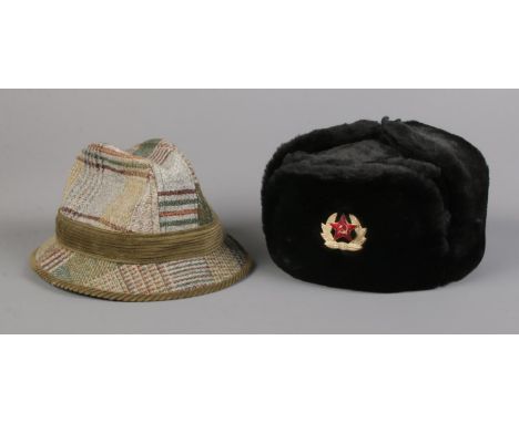 A Soviet army Ushanka hat, labelled 62 to the inside, together with a Mybro tweed example.  