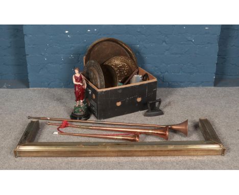 A collection of metalwares to include brass fireplace surround, copper post horns and metal plates.  