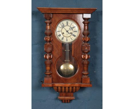 Gustav Becker mahogany wall clock with glazed pendulum display.  Damage to face enamel cracked and chipping between 3 and 4