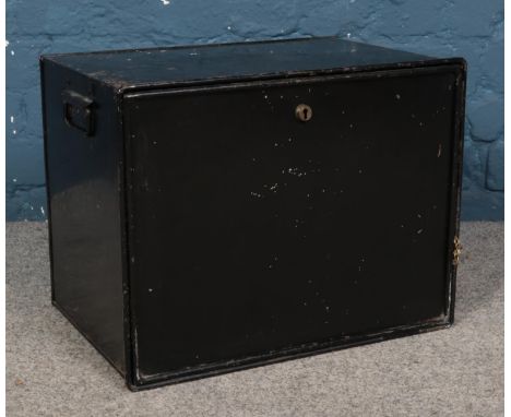 A lockable metal trunk, bearing label for 'Jones Brothers, Wolverhampton'. With key. Height: 36cm, Width: 46cm.  