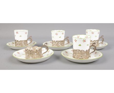 A set of Crown Staffordshire rosebud cups and saucers with William Comyns &amp; Sons Ltd silver holders. Hallmarked Birmingha