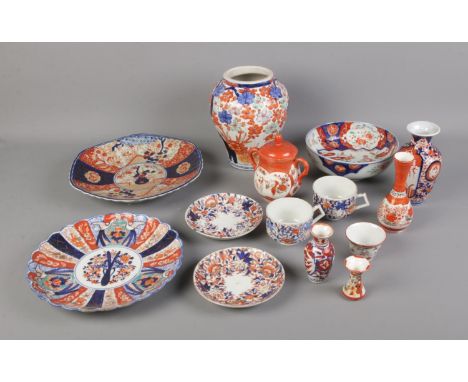 A collection of oriental ceramics including Imari pattern vase, bowl, plates, etc.  