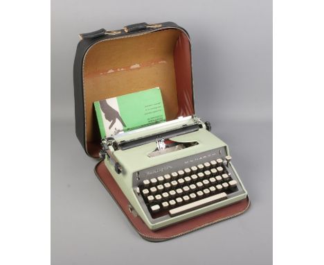 Remington Monarch type writer in travel  case and manual.  