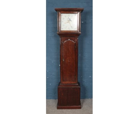 Oak longcase clock for restoration, with central foliate crest to the door, Hand painted Arabic numeral dial. Weight and pend