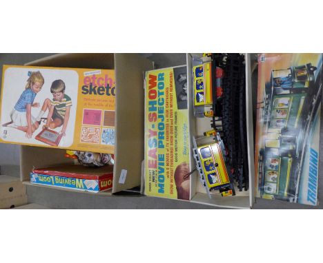 A box of children's games including Etch-A-Sketch, Chad Valley Movie Projector, Fisher Price, etc. **PLEASE NOTE THIS LOT IS 