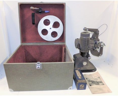 A Bell &amp; Howell Gaumont Model 613 Projector in case with reel, tools, original instructions and spare lamp 