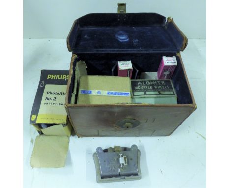 A leather box case containing a spare projector lamp, a GB projector lense and spindles. 